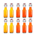 Wholesale Clear Round Glass Beer Bottles Beverage bottles with swing top